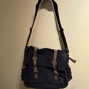 S.C. Cotton black canvas messenger bag with brown leather accents. EUC